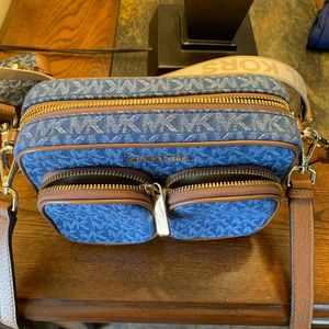 Michael Kors crossbody bag comes with both straps